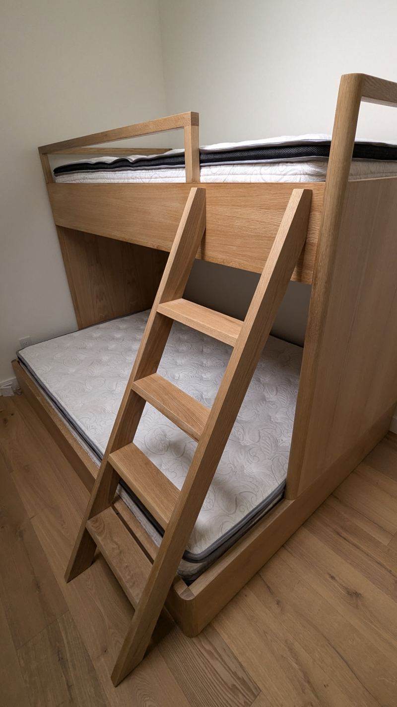 Built-in oak bunk beds with a ladder