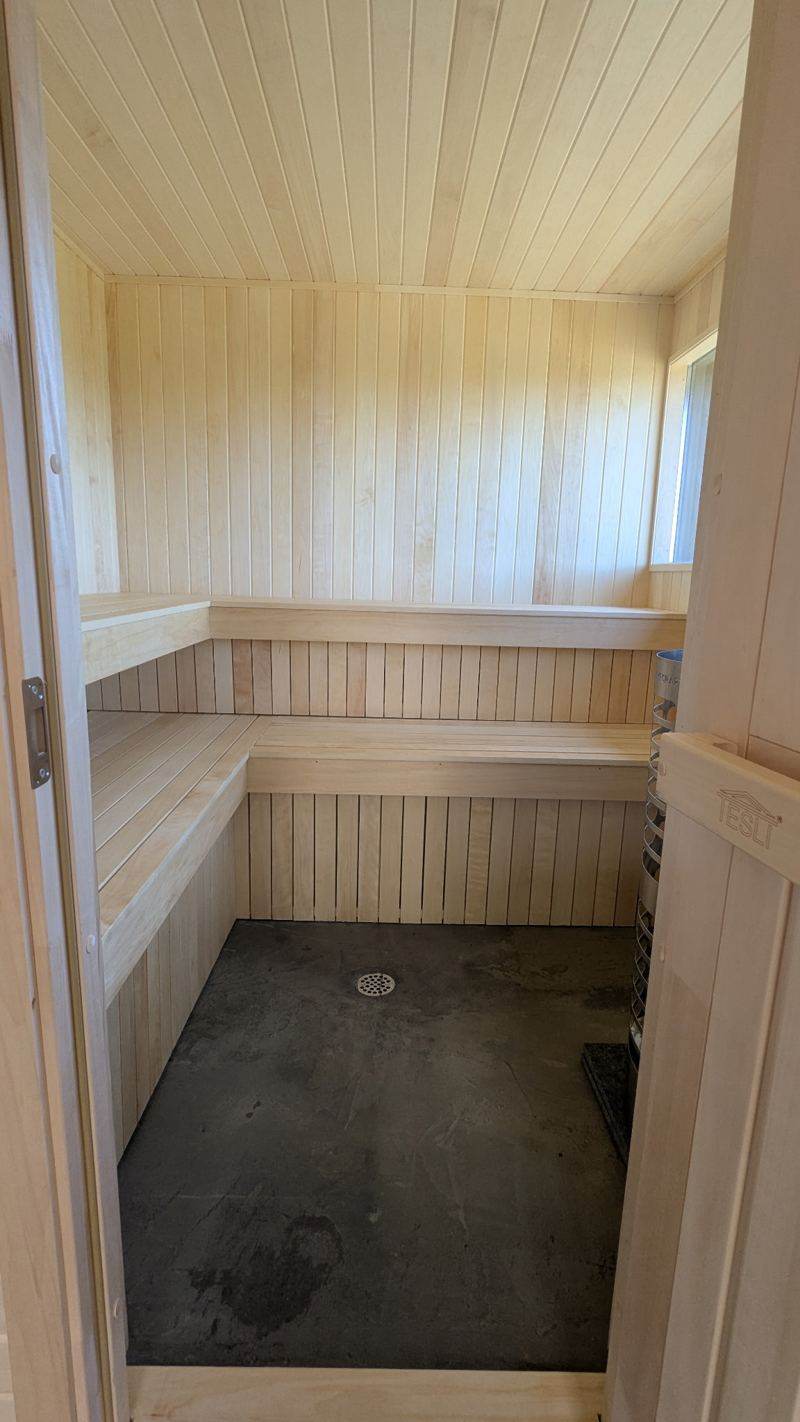 Wood-lined sauna with benches