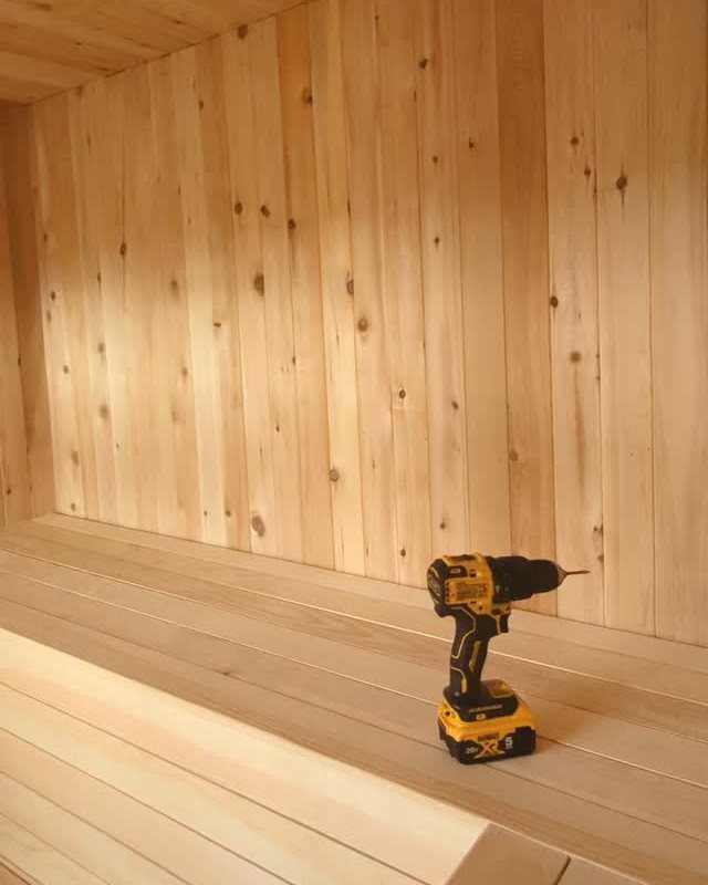Cedar-lined sauna interior with wide plank benches