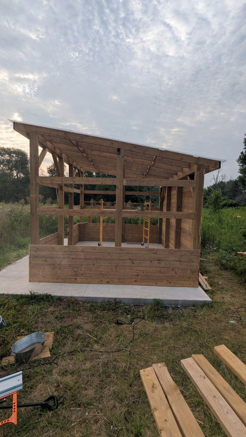 Timber frame of a small building going up