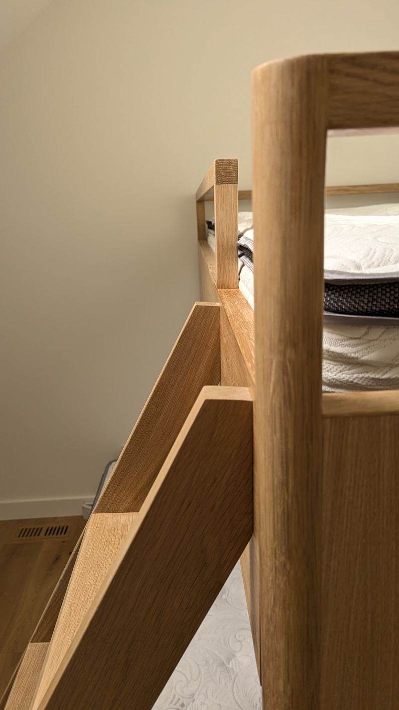 Close-up of the oak bunk bed ladder and rail